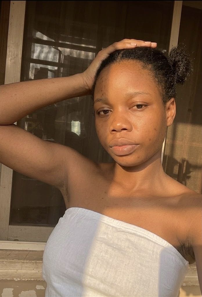 Girl from Nigeria relaxing at home, ready for a chat